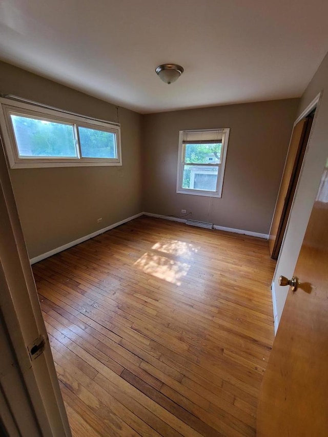 15408 Dobson Ave, Dolton, IL 60419 - unfurnished room with plenty of natural light and light wood-style floors