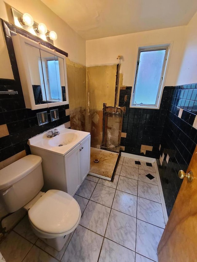 15408 Dobson Ave, Dolton, IL 60419 - full bathroom featuring tile walls, vanity, a wainscoted wall, marble finish floors, and a shower