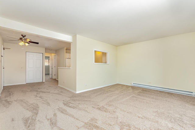 1131 Cedar St Unit 2B, Glendale Heights, IL 60139 - empty room featuring a baseboard heating unit, carpet, and a ceiling fan