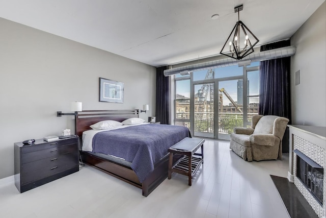 1001 W Madison St Unit 710, Chicago, IL 60607 - bedroom with a chandelier and access to outside
