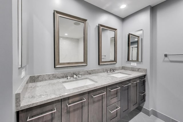 1001 W Madison St Unit 710, Chicago, IL 60607 - bathroom featuring double vanity and baseboards