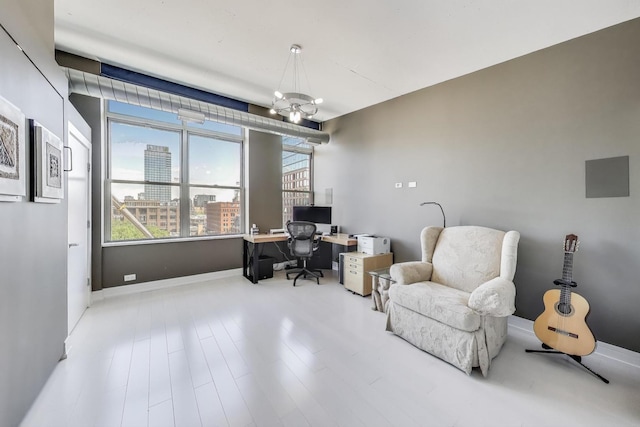 1001 W Madison St Unit 710, Chicago, IL 60607 - office area featuring a chandelier and baseboards
