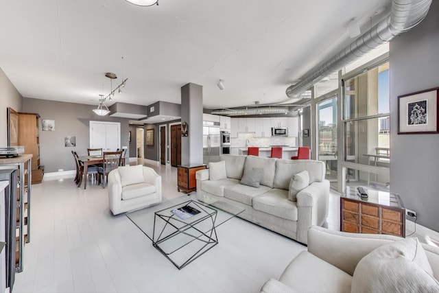 1001 W Madison St Unit 710, Chicago, IL 60607 - living room with baseboards