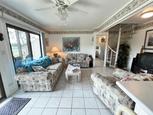 56 Vail Colony Unit 1, Fox Lake, IL 60020 - living area featuring light tile patterned flooring and ceiling fan