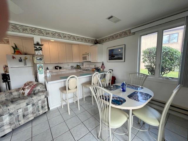 56 Vail Colony Unit 1, Fox Lake, IL 60020 - dining space featuring light tile patterned floors