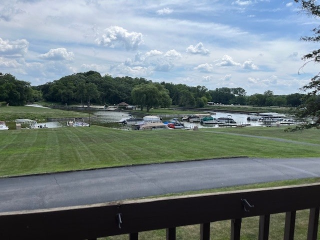 56 Vail Colony Unit 1, Fox Lake, IL 60020 - view of parking with a water view