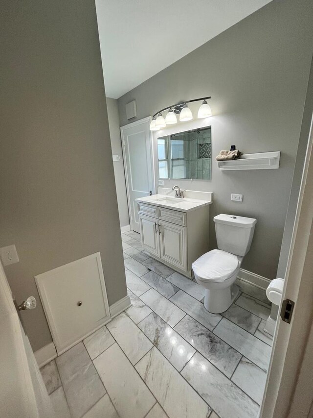 407 N William St, Joliet, IL 60435 - bathroom with marble look tile flooring and vanity