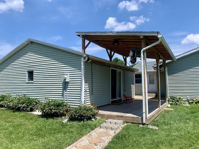 3122 Arlington Dr, Princeton, IL 61356 - rear view of house featuring a wooden deck and a lawn