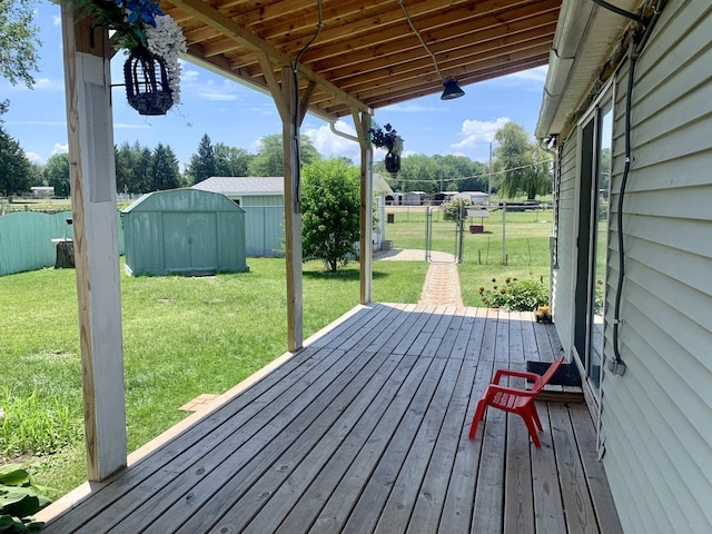 3122 Arlington Dr, Princeton, IL 61356 - wooden deck featuring a storage unit and a fenced backyard