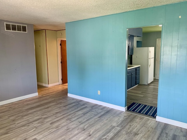 3122 Arlington Dr, Princeton, IL 61356 - unfurnished room with wood finished floors and a textured ceiling