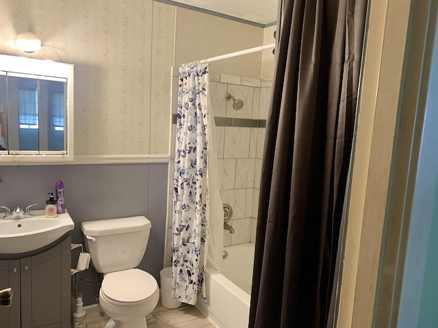 3122 Arlington Dr, Princeton, IL 61356 - full bath with vanity, shower / bath combo with shower curtain, wood finished floors, and wallpapered walls