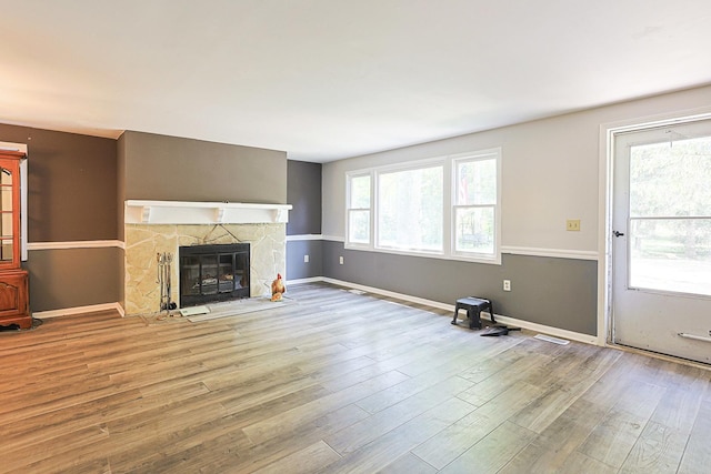 108 Poplar St, Mchenry, IL 60051 - unfurnished living room with wood finished floors and a stone fireplace