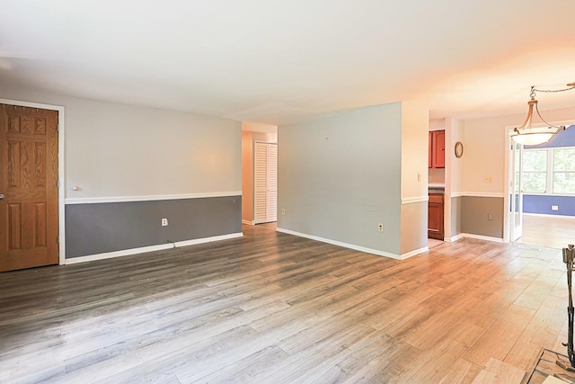 108 Poplar St, Mchenry, IL 60051 - spare room with light wood finished floors and a chandelier