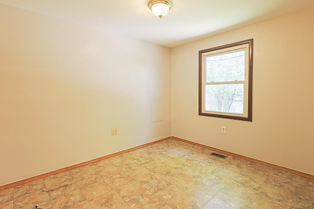 108 Poplar St, Mchenry, IL 60051 - spare room with baseboards and stone finish floors