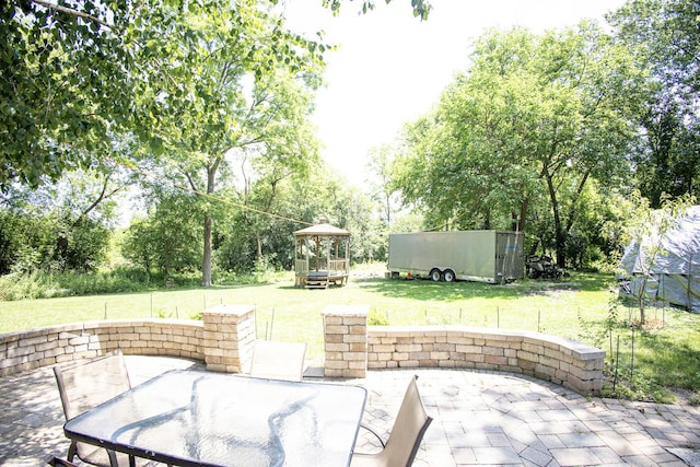 108 Poplar St, Mchenry, IL 60051 - view of patio / terrace with outdoor dining area, view of scattered trees, and a gazebo