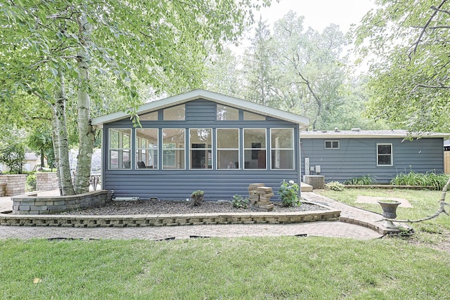 108 Poplar St, Mchenry, IL 60051 - view of front of home featuring a sunroom and a front yard