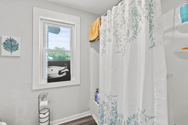 305 Irving St, Joliet, IL 60432 - bathroom with wood finished floors and shower / bathtub combination with curtain