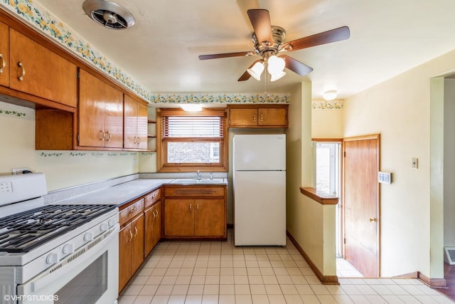 13247 S S Ave M, Chicago, IL 60633 - kitchen featuring white appliances, brown cabinets, ceiling fan, and light countertops
