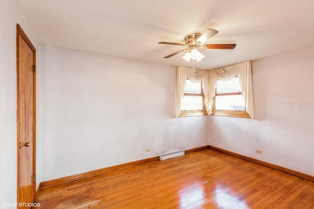 13247 S S Ave M, Chicago, IL 60633 - empty room with baseboard heating, ceiling fan, and light wood-style floors