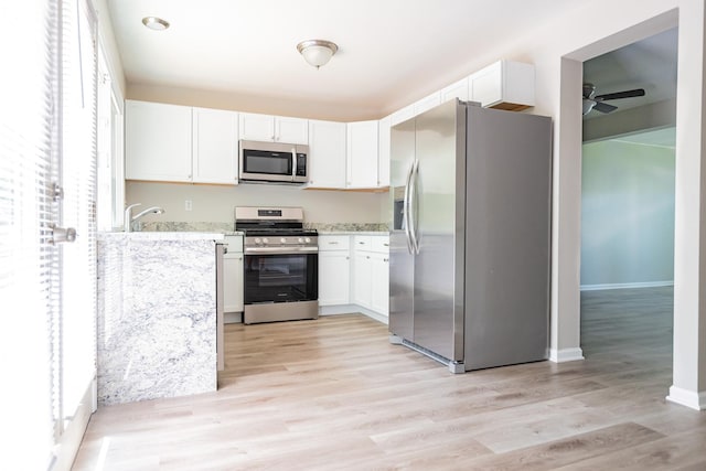 447 Yorkshire Sq, Bolingbrook, IL 60440 - kitchen featuring appliances with stainless steel finishes, light stone countertops, white cabinetry, and ceiling fan