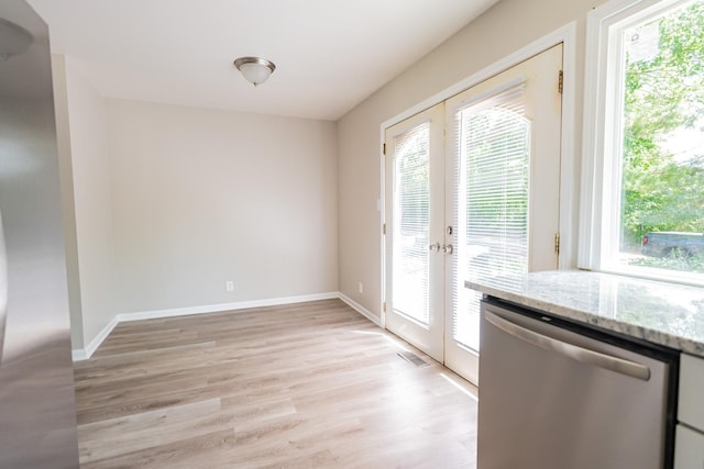 447 Yorkshire Sq, Bolingbrook, IL 60440 - entryway featuring plenty of natural light, french doors, and light wood finished floors