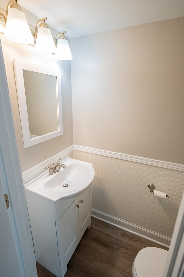 447 Yorkshire Sq, Bolingbrook, IL 60440 - bathroom featuring vanity, a wainscoted wall, and wood finished floors