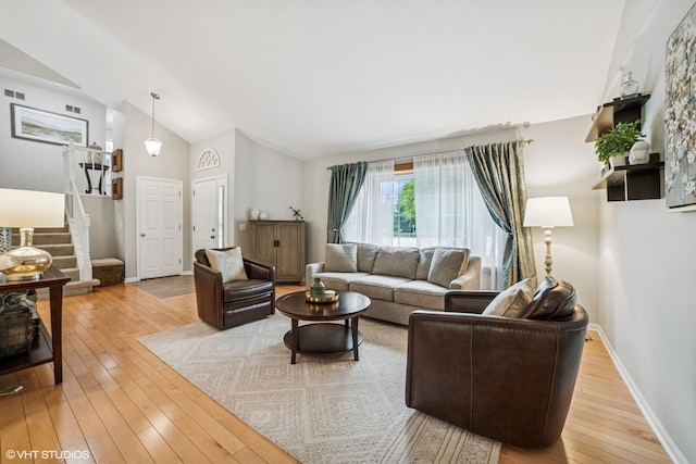 930 Bristol Trail Rd, Lake Zurich, IL 60047 - living room featuring lofted ceiling, stairs, and light wood finished floors