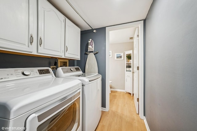 930 Bristol Trail Rd, Lake Zurich, IL 60047 - laundry room featuring separate washer and dryer, cabinet space, and light wood finished floors