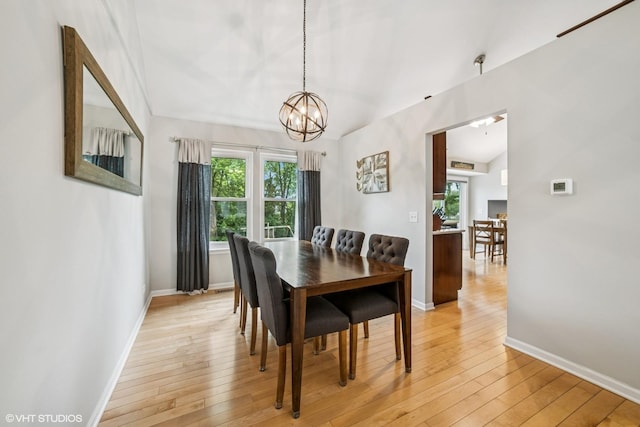 930 Bristol Trail Rd, Lake Zurich, IL 60047 - dining room featuring lofted ceiling, a chandelier, and light wood-style flooring