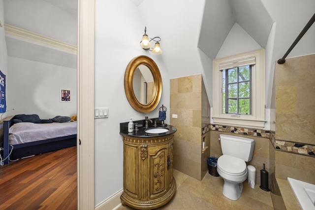 6280 Blackstone Ave, La Grange Highlands, IL 60525 - full bath with tile walls, tiled tub, vanity, wainscoting, and ensuite bath