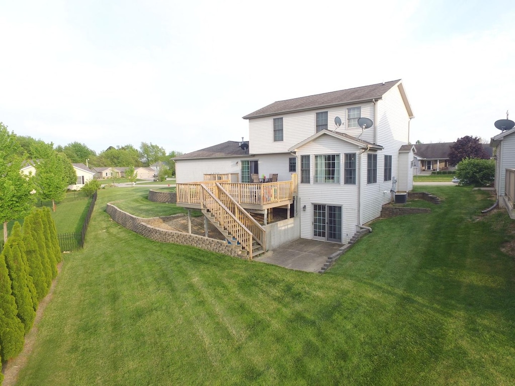 409 Boulder St, Heyworth, IL 61745 - rear view of house featuring a deck, a patio, and stairway