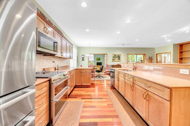 20015 Founders Way, Olympia Fields, IL 60461 - kitchen with appliances with stainless steel finishes, light wood-style flooring, healthy amount of natural light, light brown cabinetry, and recessed lighting