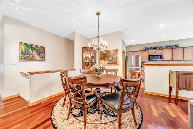 20015 Founders Way, Olympia Fields, IL 60461 - dining room with a chandelier and light wood-style floors