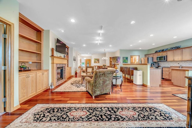 20015 Founders Way, Olympia Fields, IL 60461 - living area featuring light wood-style floors, a brick fireplace, and recessed lighting