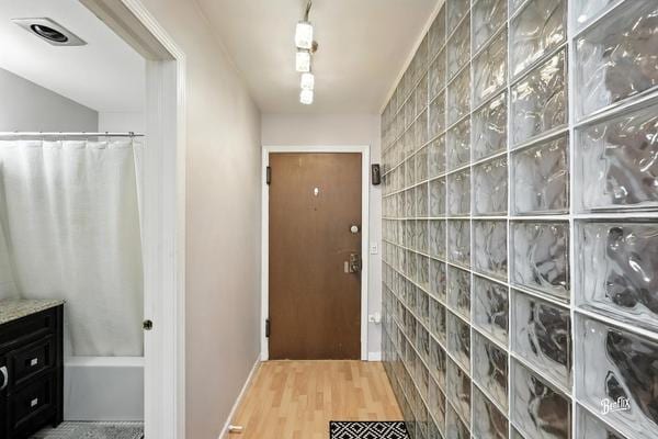1425 Sandpebble Dr Unit 340, Wheeling, IL 60090 - doorway featuring wood finished floors and baseboards