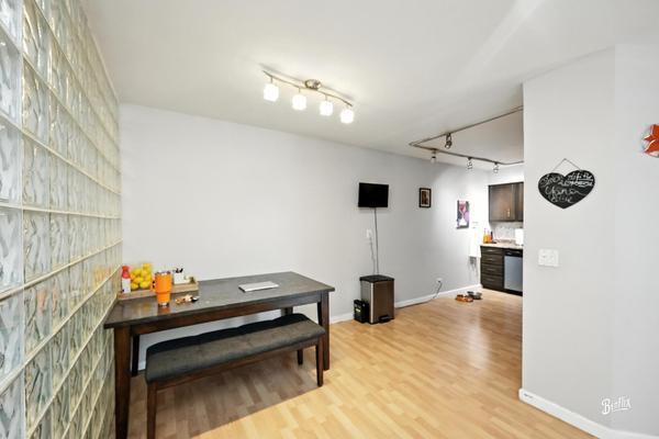 1425 Sandpebble Dr Unit 340, Wheeling, IL 60090 - dining space featuring track lighting and light wood finished floors