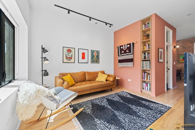 3632 S Winchester Ave, Chicago, IL 60609 - living area featuring track lighting, wood finished floors, and built in shelves