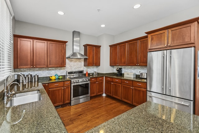 10 Park Ave, River Forest, IL 60305 - kitchen featuring appliances with stainless steel finishes, wall chimney exhaust hood, dark stone countertops, tasteful backsplash, and recessed lighting
