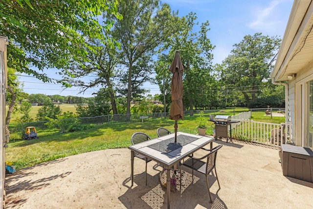 123 Tilton Park Dr, Dekalb, IL 60115 - fenced backyard featuring outdoor dining space, area for grilling, and a patio area