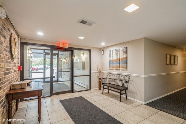 1205 E Hintz Rd Unit 206, Arlington Heights, IL 60004 - community lobby featuring brick wall and recessed lighting