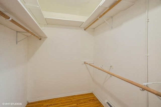 1205 E Hintz Rd Unit 206, Arlington Heights, IL 60004 - walk in closet with light wood-style flooring and baseboard heating