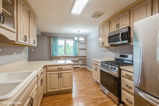 1205 E Hintz Rd Unit 206, Arlington Heights, IL 60004 - kitchen featuring appliances with stainless steel finishes, light countertops, light brown cabinets, and light wood-type flooring