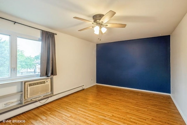 1205 E Hintz Rd Unit 206, Arlington Heights, IL 60004 - unfurnished room featuring a baseboard heating unit, light wood finished floors, ceiling fan, and an AC wall unit