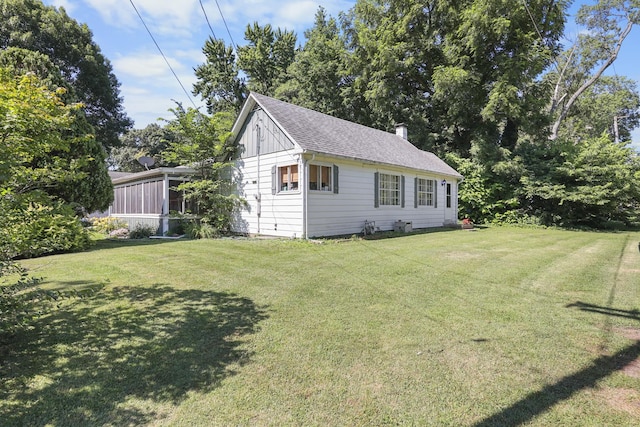 162 Grant St, Seneca, IL 61360 - view of front facade featuring a front lawn, a chimney, and a shingled roof