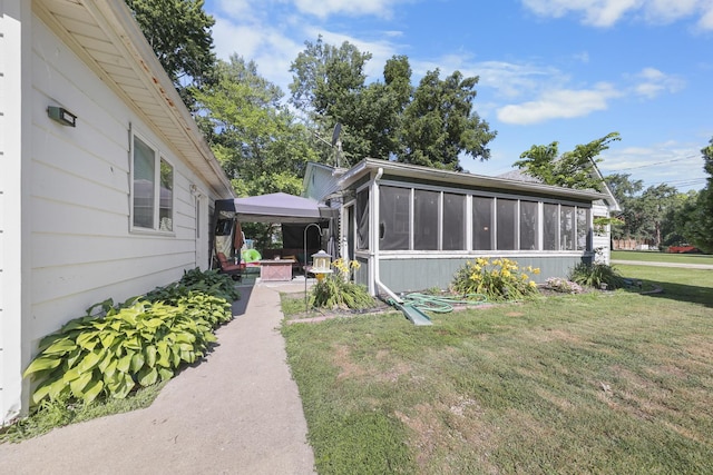 162 Grant St, Seneca, IL 61360 - view of green lawn featuring a sunroom and a patio area