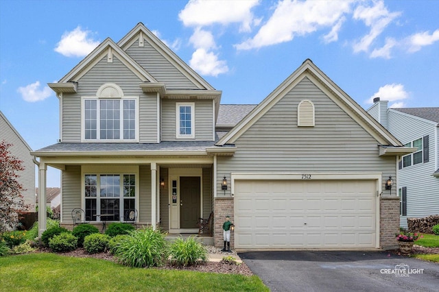 7512 Prairieside Dr, Plainfield, IL 60586 - traditional home featuring brick siding, asphalt driveway, covered porch, and a garage