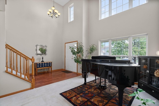 7512 Prairieside Dr, Plainfield, IL 60586 - carpeted foyer entrance featuring a towering ceiling and a chandelier
