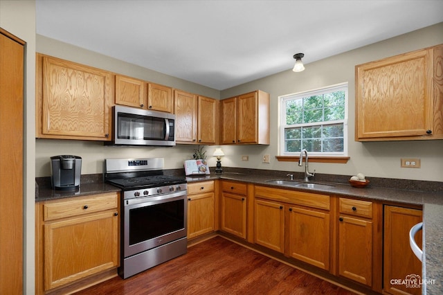 7512 Prairieside Dr, Plainfield, IL 60586 - kitchen featuring stainless steel appliances, dark wood finished floors, and dark countertops