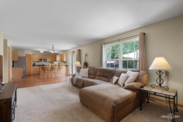 7512 Prairieside Dr, Plainfield, IL 60586 - living room with light carpet and a chandelier