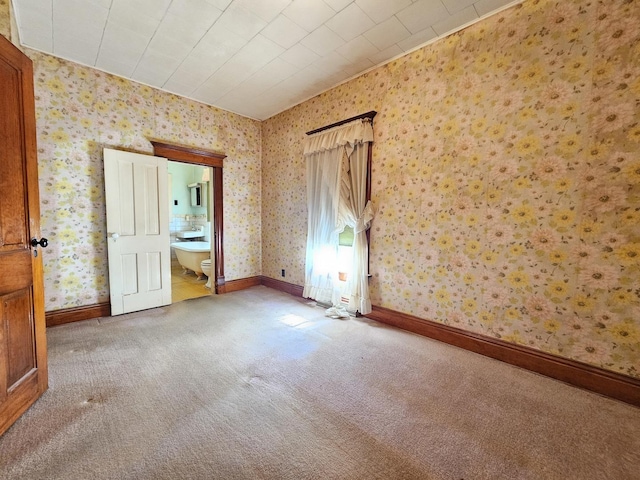 216 E Delaware St, Dwight, IL 60420 - carpeted spare room featuring wallpapered walls and baseboards